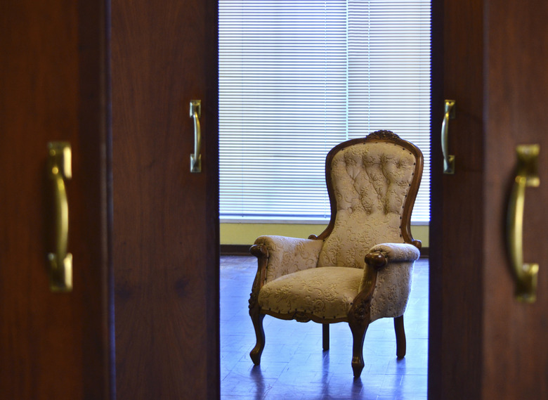 Victorian style chair framed by doorways