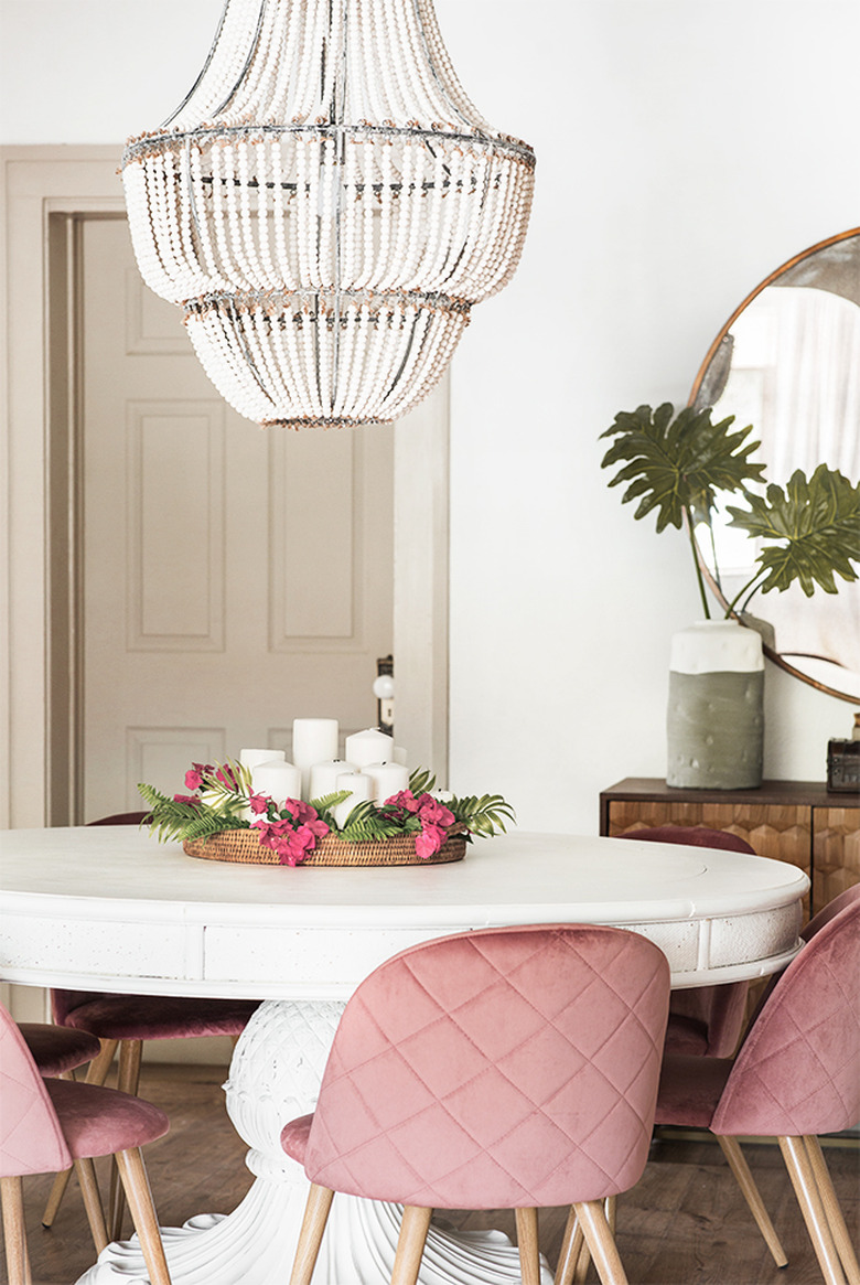 Greige trim and white walls with a round dining table