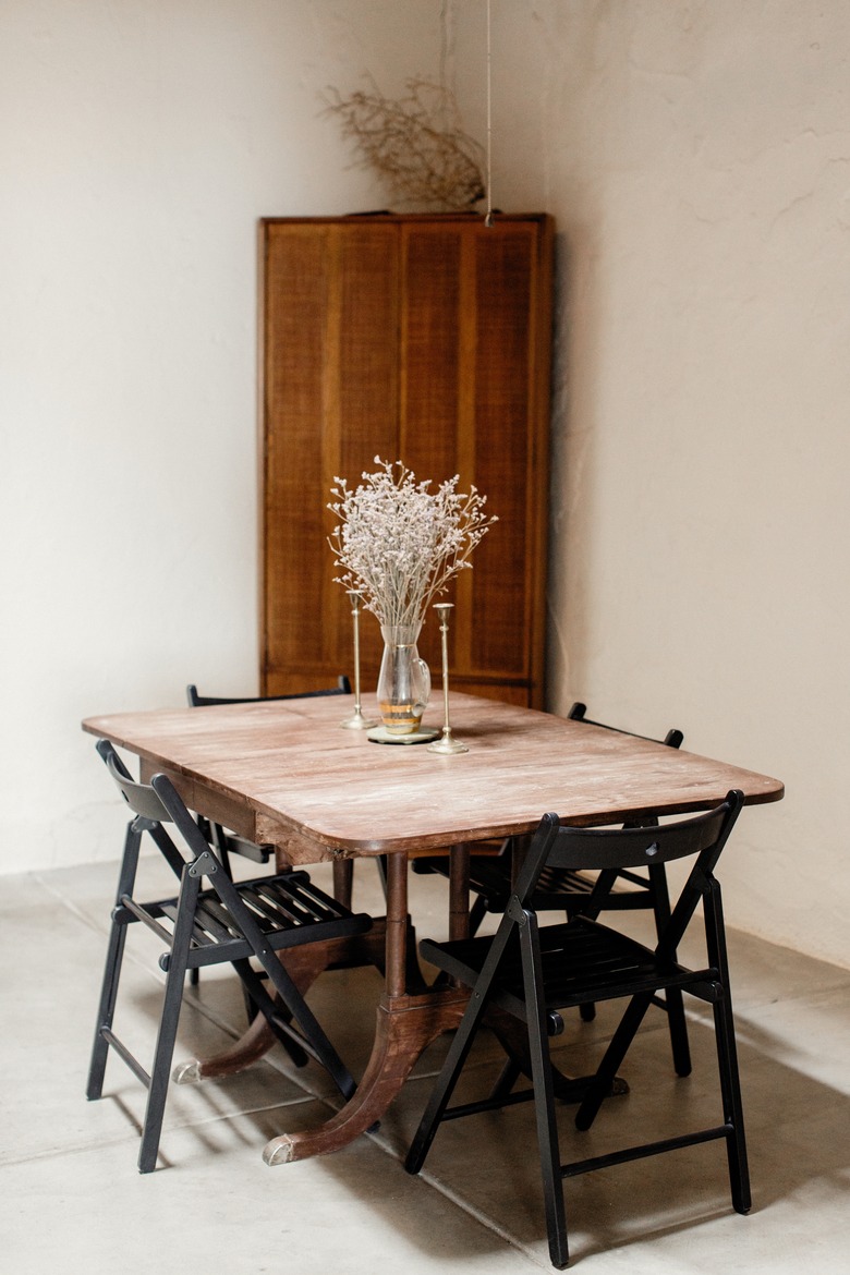 Minimal California dining room with wood storage cabinet