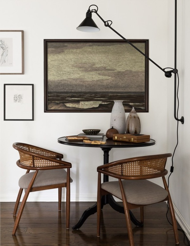 dining room table idea for small space with room for two chairs and wall-mounted light fixture