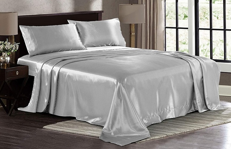 Light-gray satin sheets.