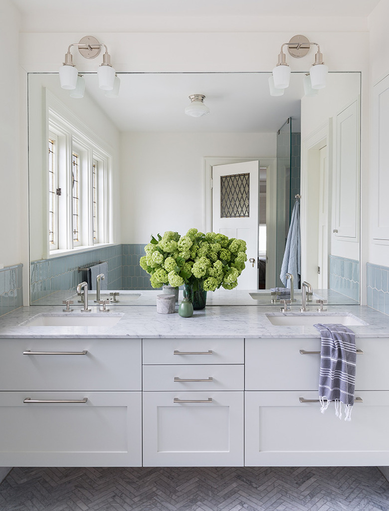 diy bathroom backsplash idea in classic bathroom with oversize traditional mirror