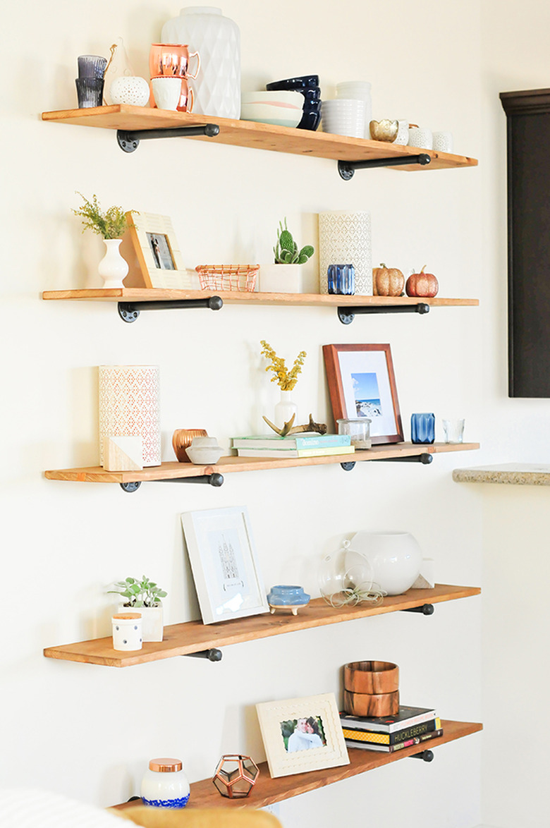 floating DIY industrial bookshelf with decor