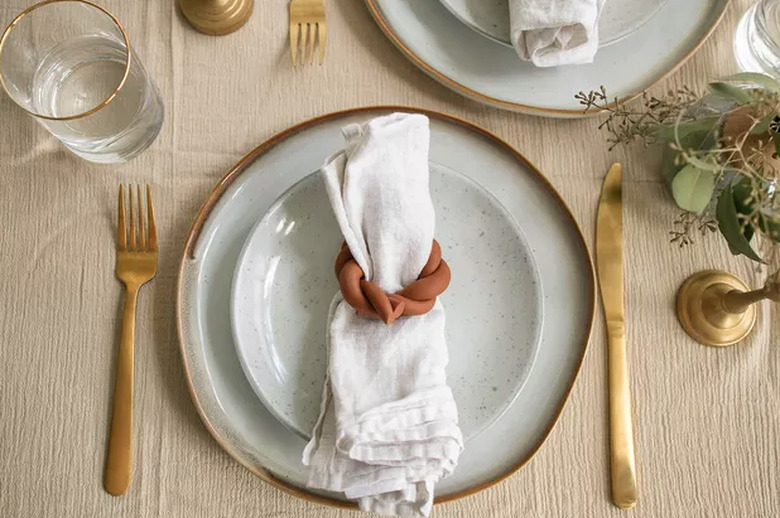 Terra cotta napkin rings on table