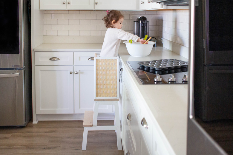 IKEA hack learning tower with child in kitchen