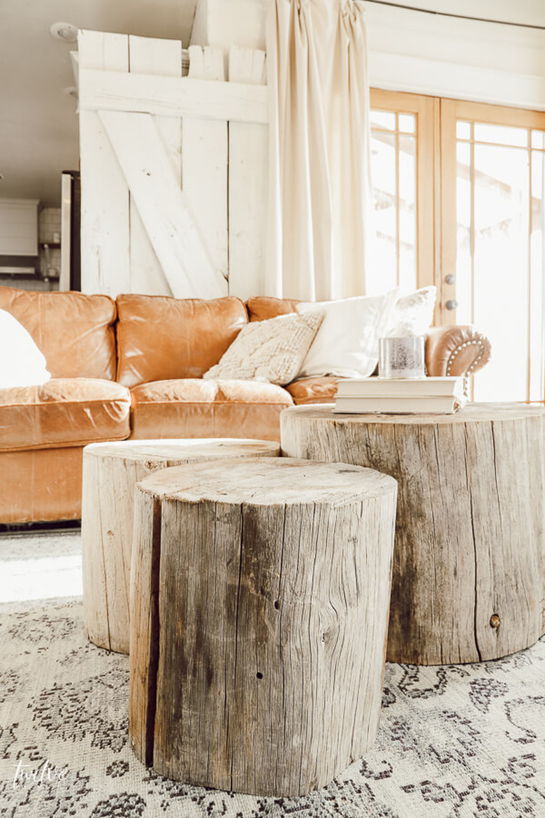 DIY rustic coffee tables in grouping of three tree stumps