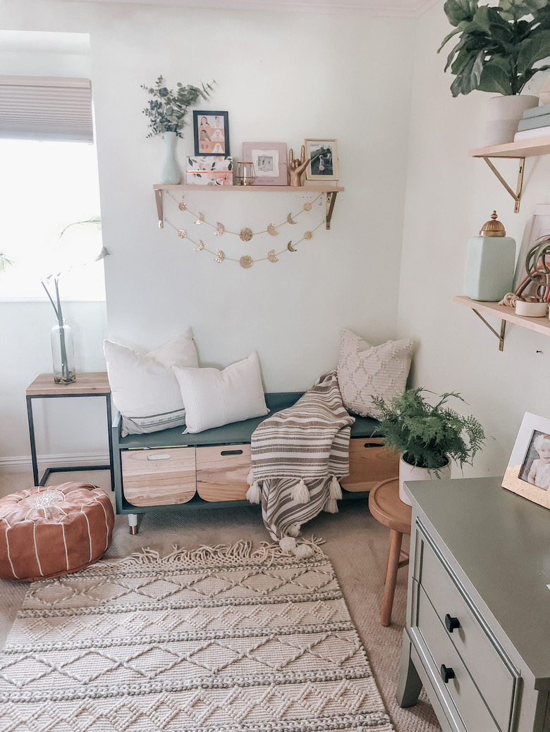 DIY storage bench with wooden bins and teal exterior in white, boho living room