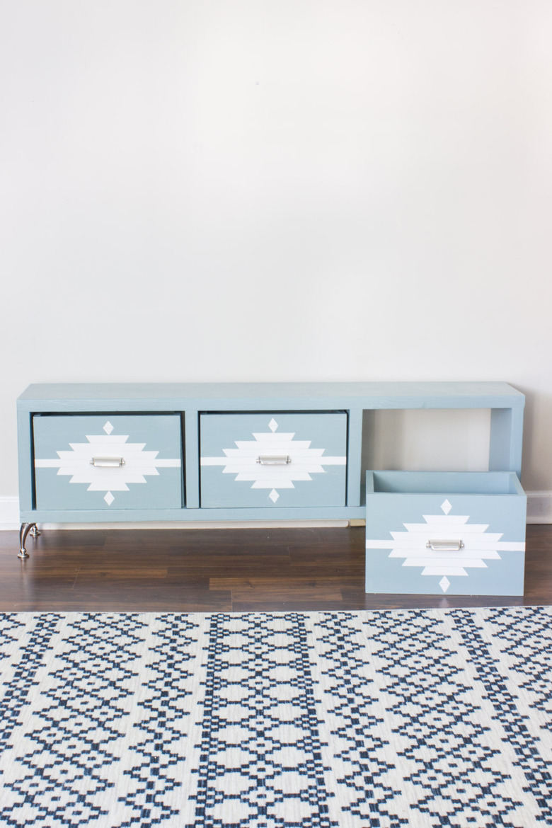 DIY storage bench in light blue with geometric detailing