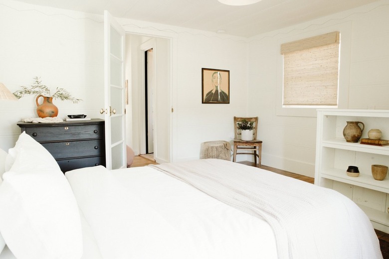 accent chair in corner of a bedroom