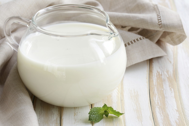 glass jug with milk, rustic style