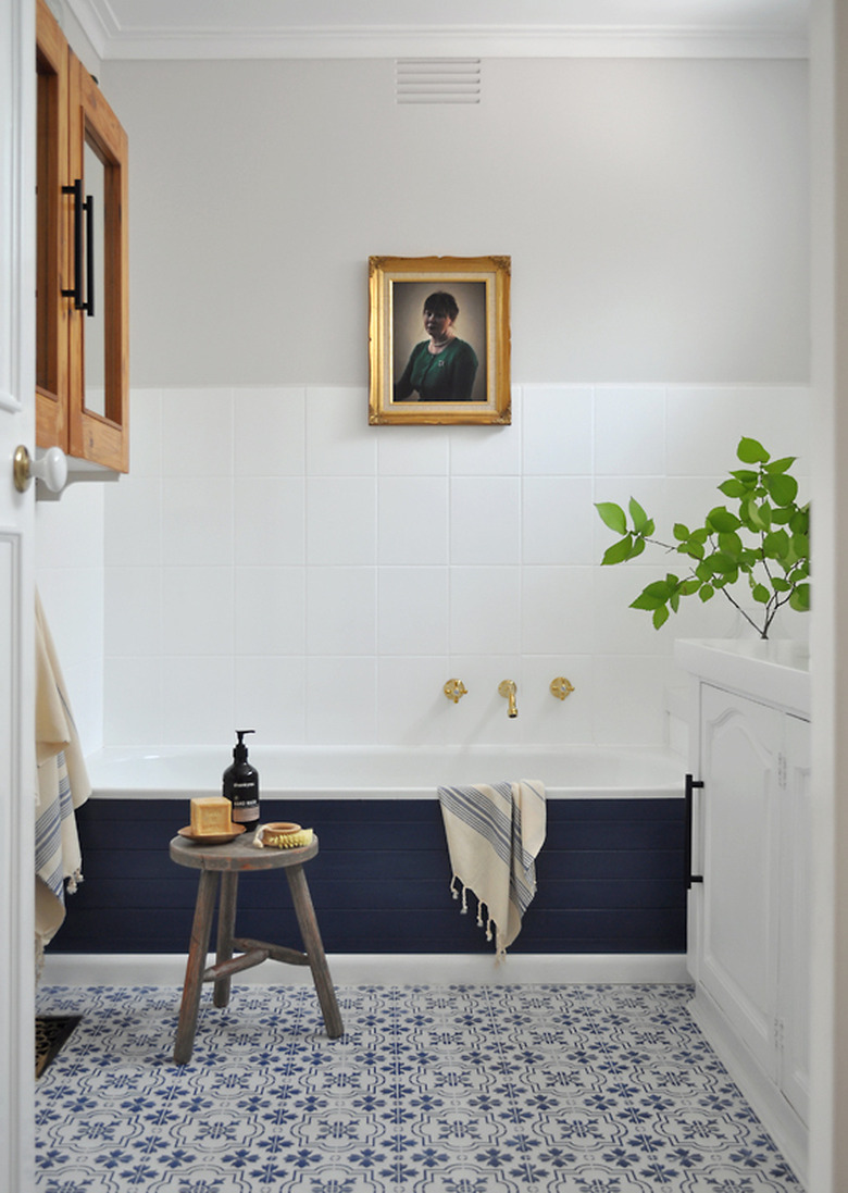 small bathtub with blue surround in modern traditional space