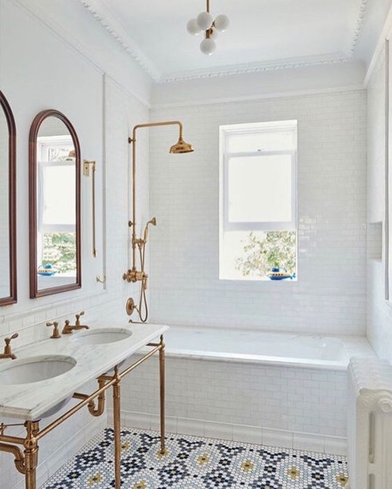 narrow art deco bathroom with small bathtub shower combo