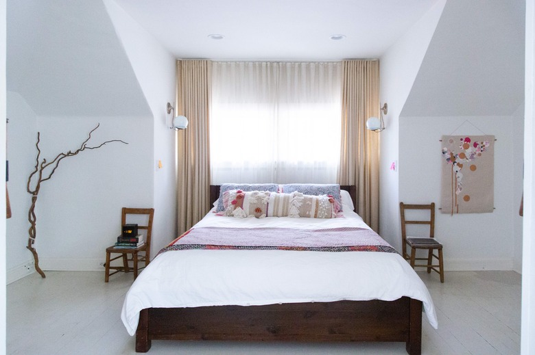 Layered window treatments in a bedroom