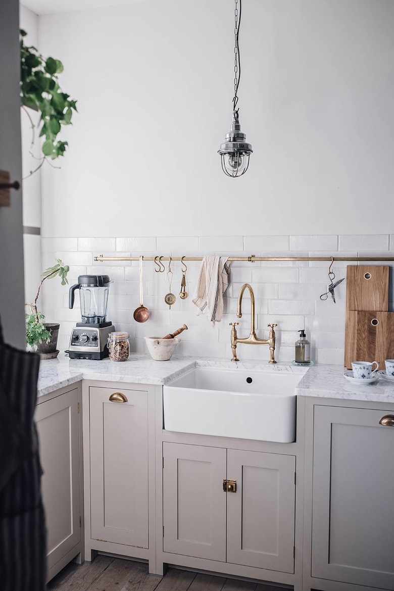 modern farmhouse kitchen backsplash with white subway tile and gray cabinets