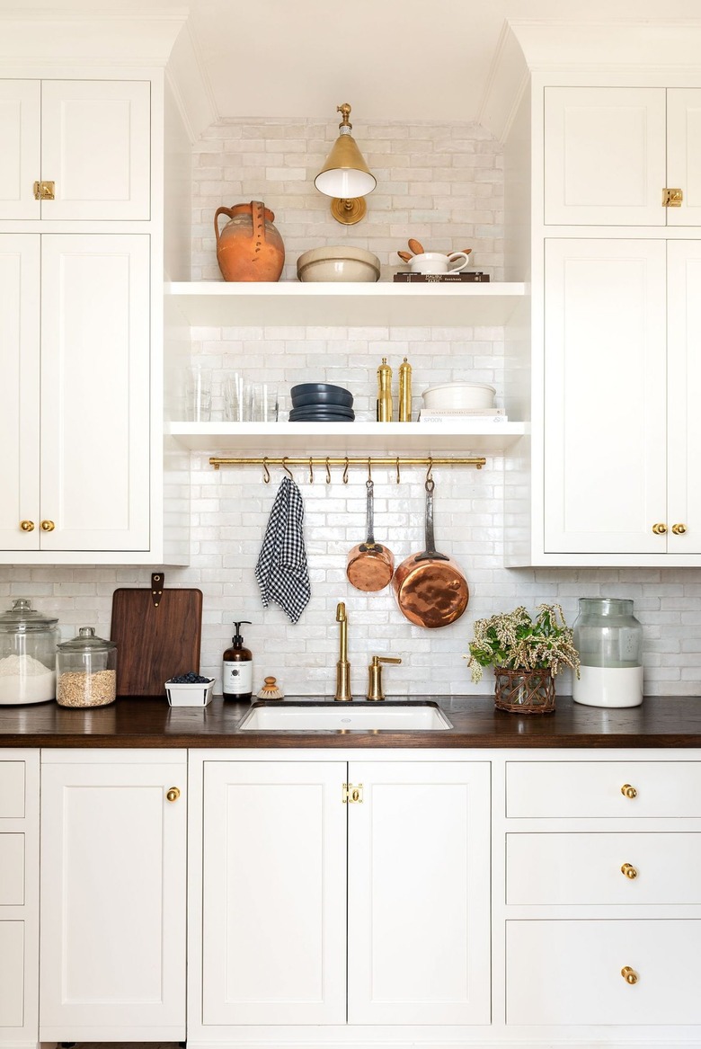 Farmhouse style pantry with white backsplash by Studio McGee