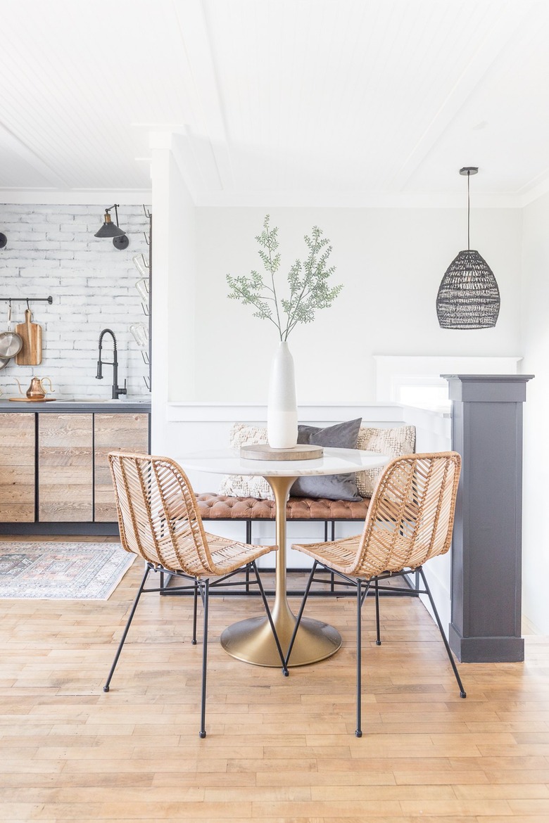 modern eat-in kitchen with bistro table and rattan chairs