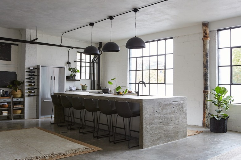 eco-friendly kitchen flooring in industrial space with concrete island