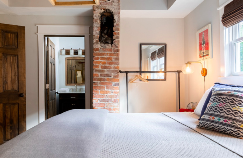 bedroom space with brick column in Craftsman home