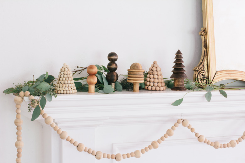 Christmas mantel with wooden forest trees