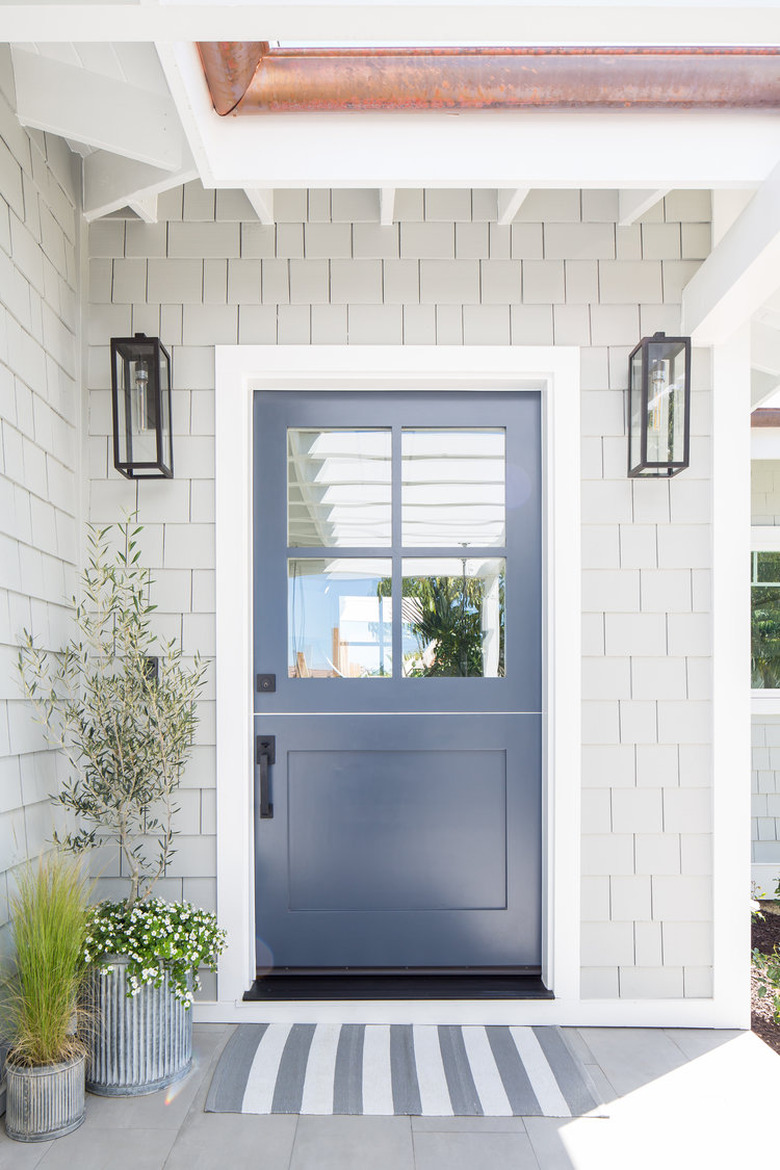 Navy blue and gray exterior beach house colors with shake siding and striped doormat