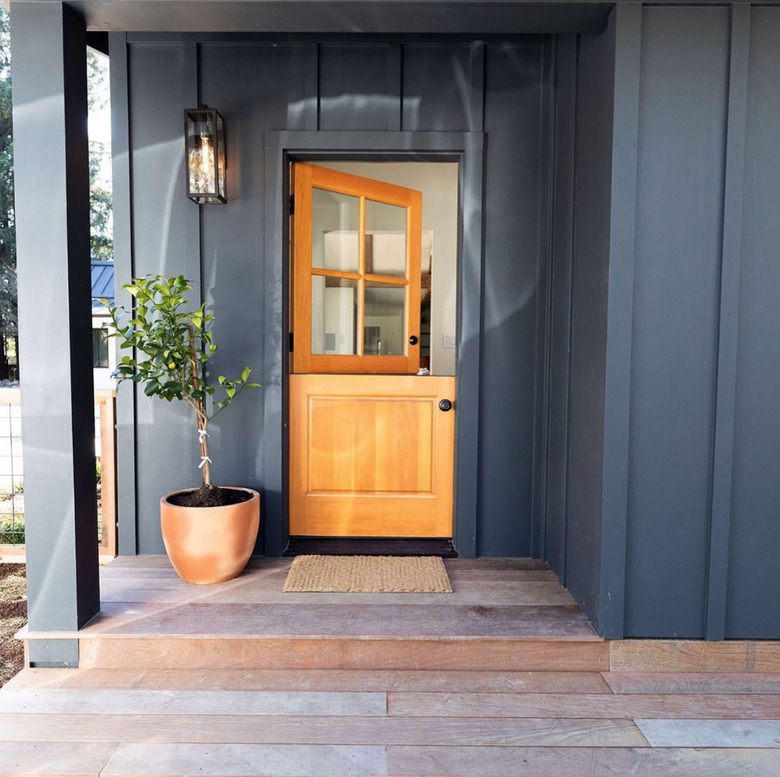 natural wood exterior Dutch door with gray walls