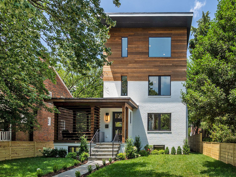 White and wood exterior house colors on modern traditional brick house