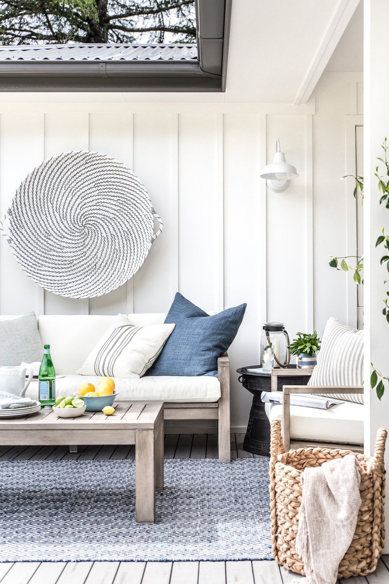 White board and batten exterior paneling in outdoor farmhouse space