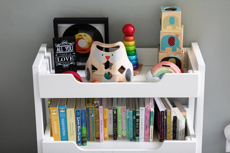 nursery shelf with toys and books