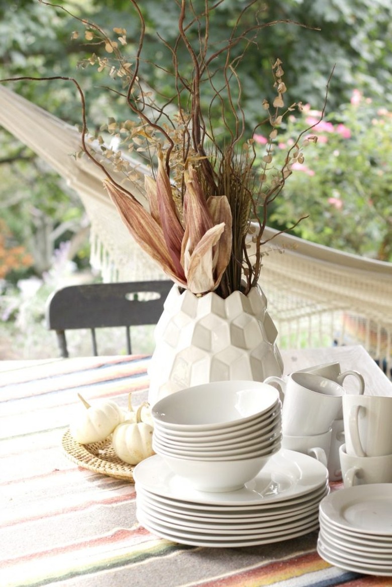 Modern fall centerpiece in white geometric vase with dried fall florals