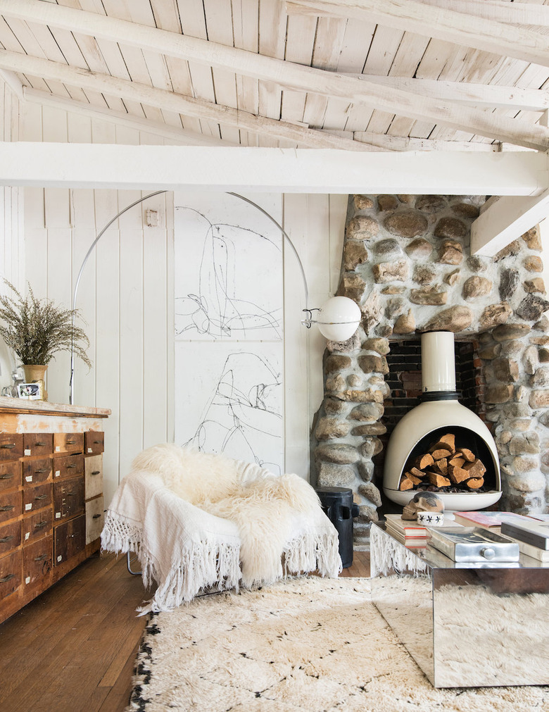 living room with sheepskin throw draped over a leather chair