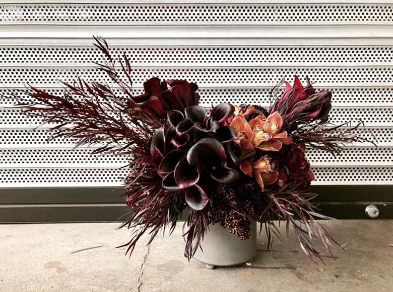 monochrome maroon fall flower arrangement