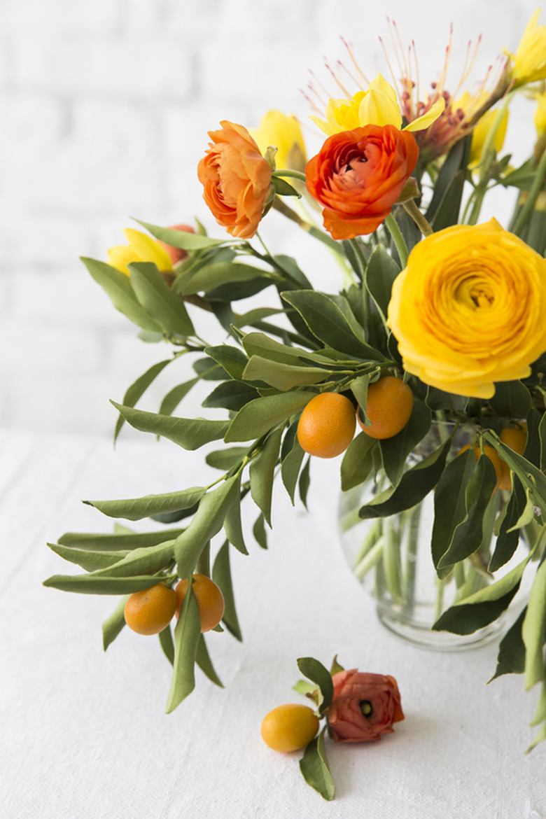 kumquat and ranunculus fall flower arrangements