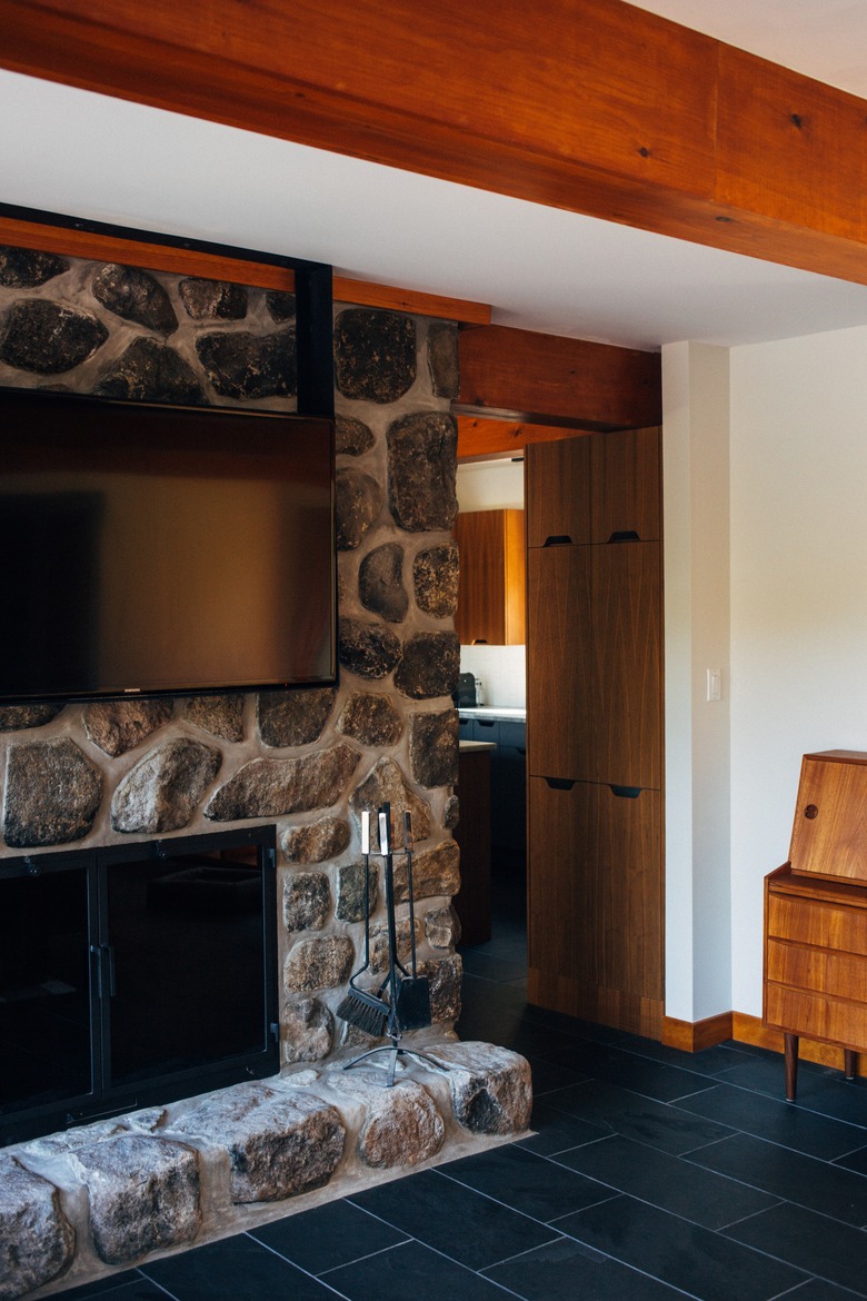 Cherrywood embellished family room with fireplace and TV layout