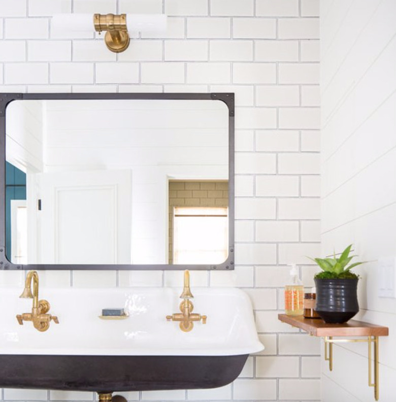 Simple and classic white subway tile partnered with a troughs sink is a match made in heaven.