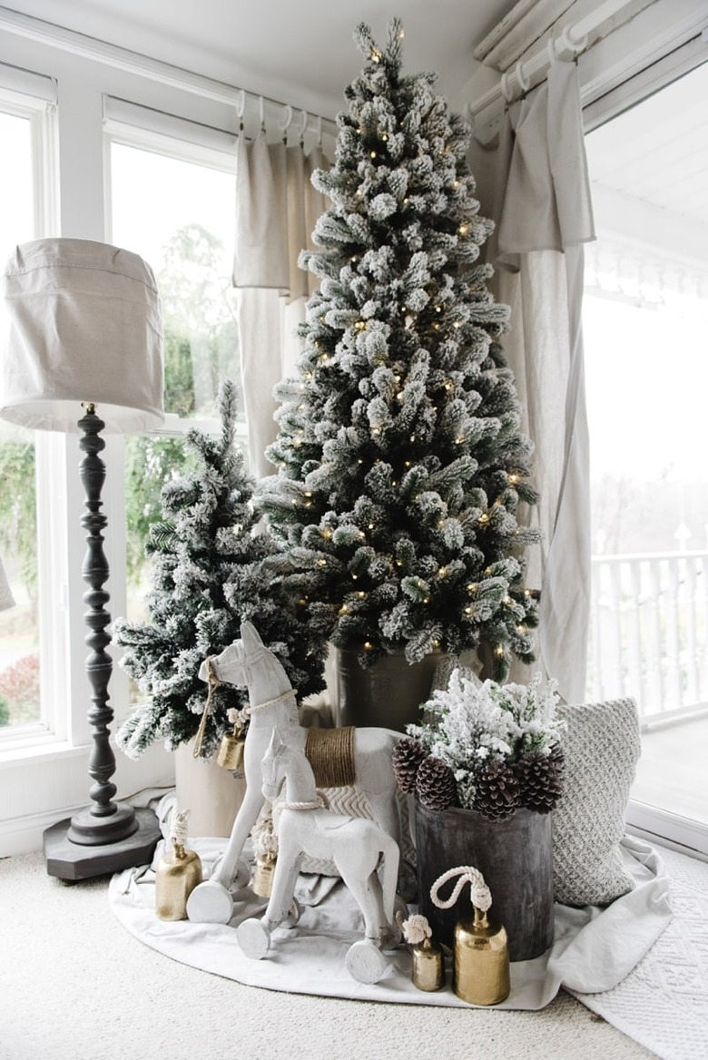 Farmhouse Christmas tree idea with two trees in corner near windows