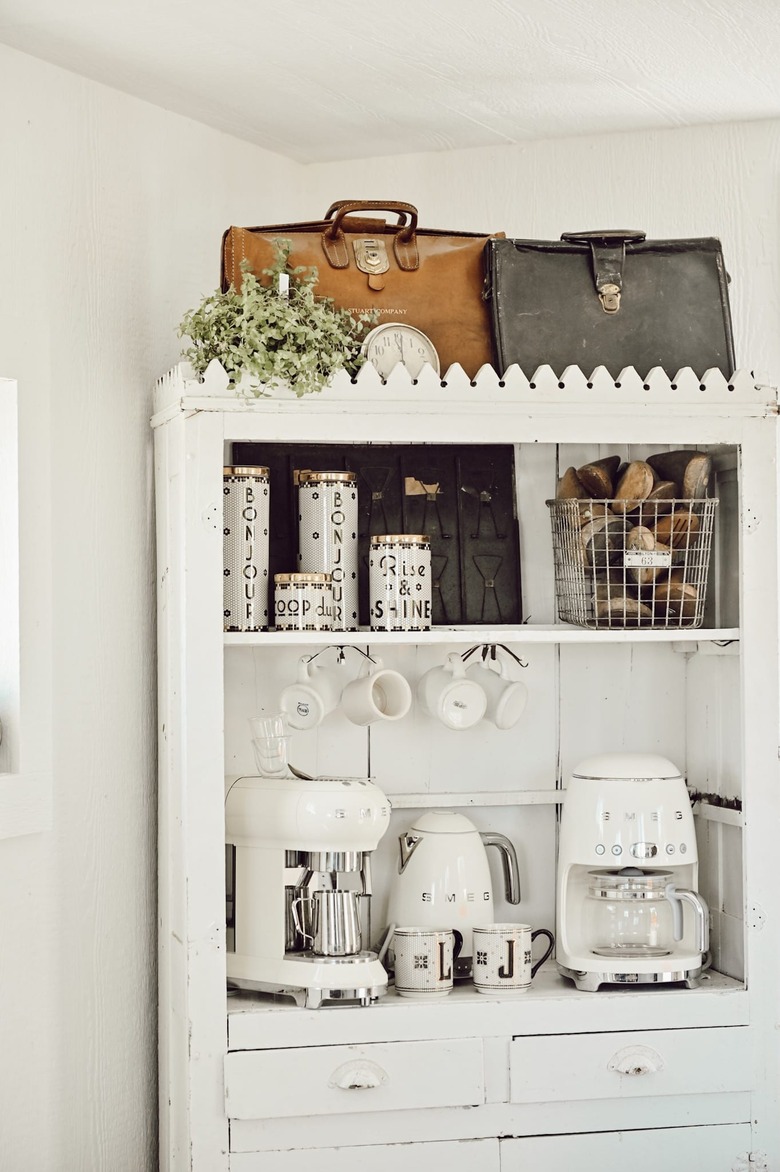 Farmhouse coffee bar with vintage accents and white small appliances