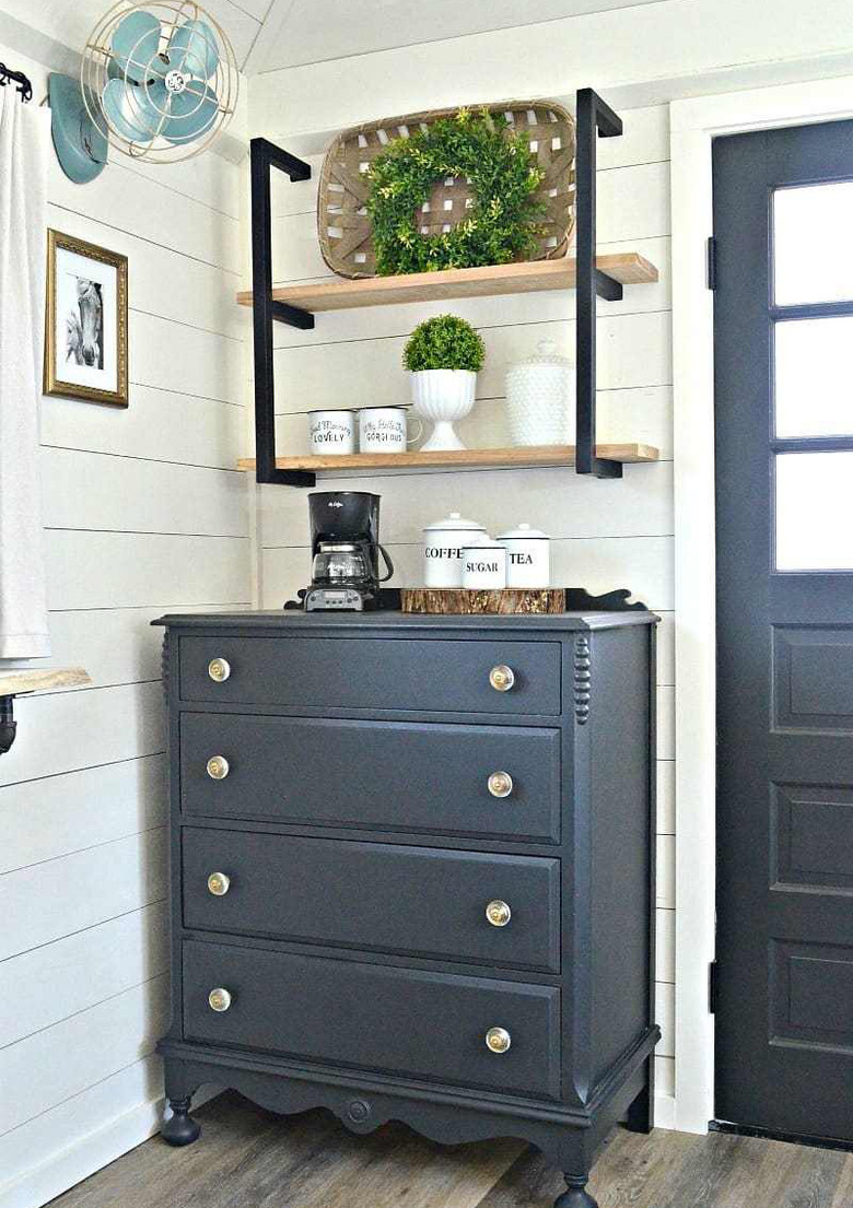 Farmhouse coffee bar with navy blue dresser and open shelving