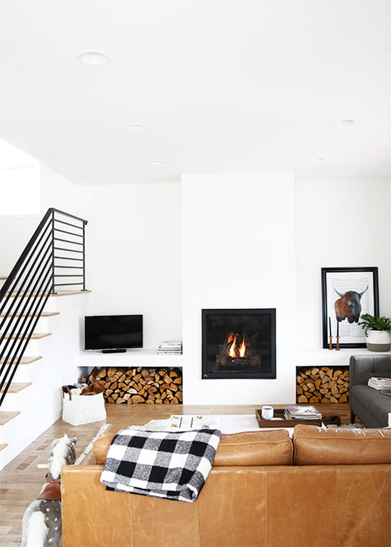 farmhouse fireplace with stacked wood