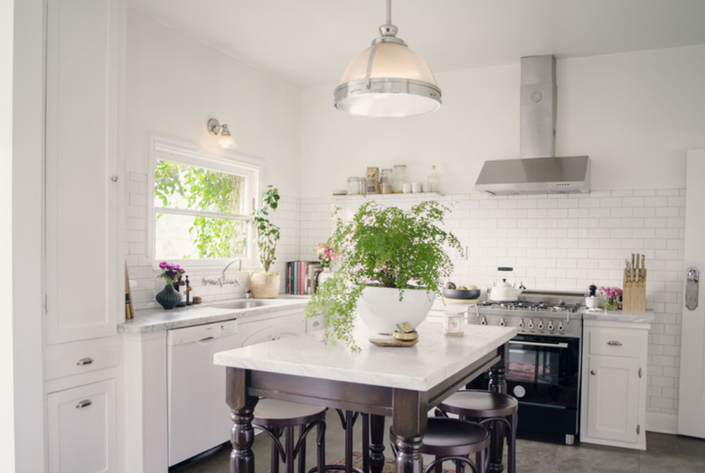 traditional boho farmhouse kitchen island idea with hand turned island