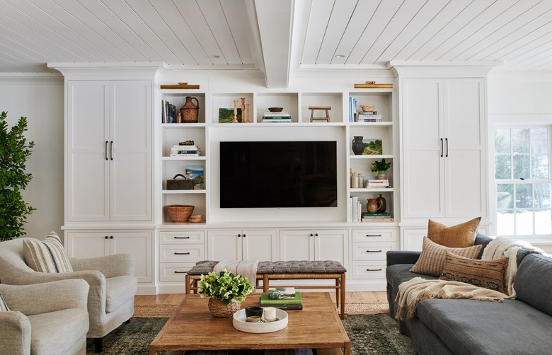 living room with tongue and groove ceiling and built in TV