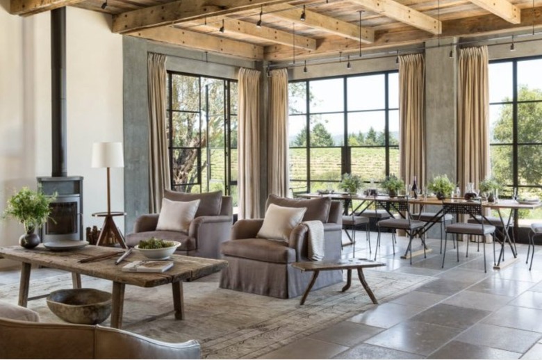 living room with limestone flooring a cross beam wood ceiling