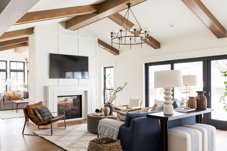 farmhouse living room with wood ceiling beams