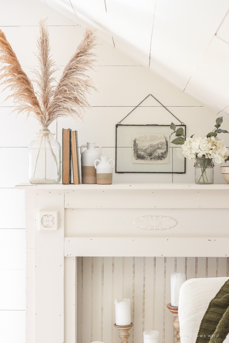 neutral farmhouse mantel decorating idea with white shiplap walls