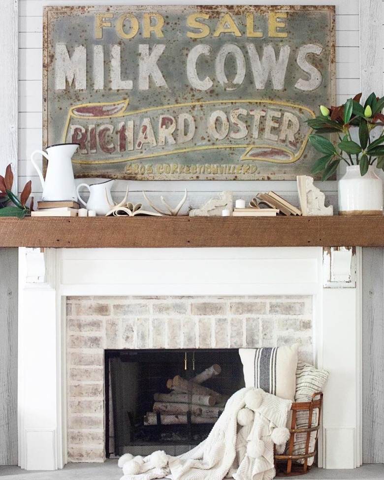 rustic farmhouse mantel decorating idea with ceramic wood pitcher and reclaimed wood