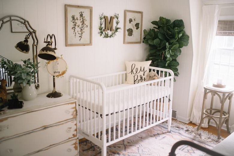 nursery idea with flea market decor and fiddle leaf fig tree near crib