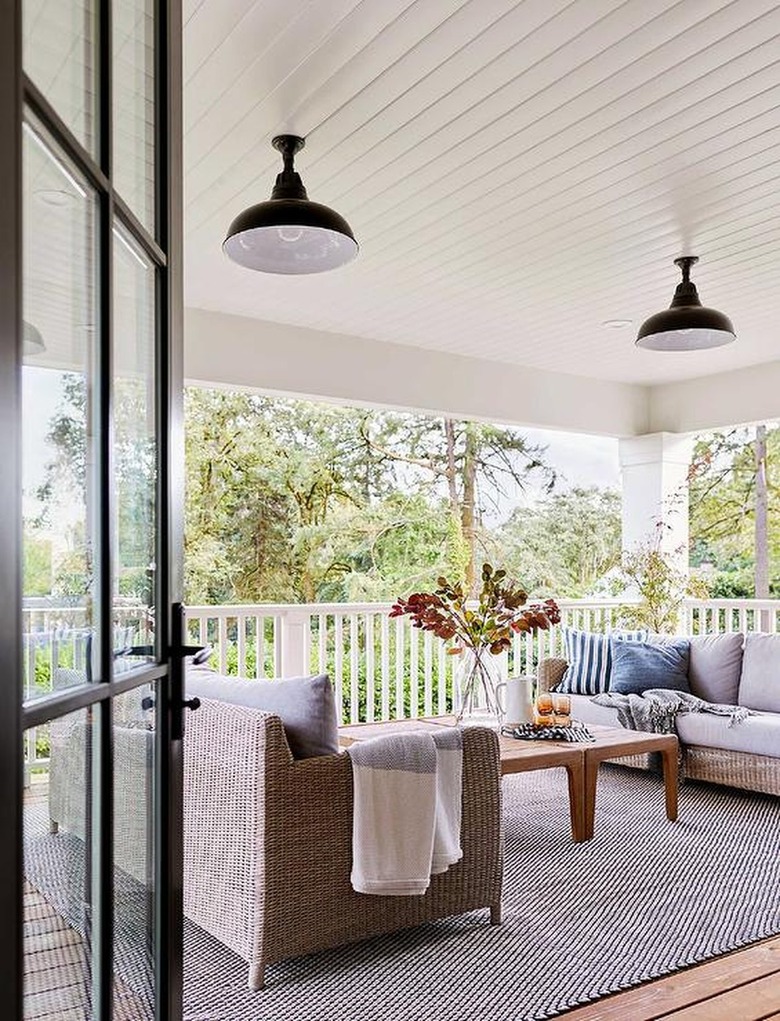 porch with couches, and black enamel lights