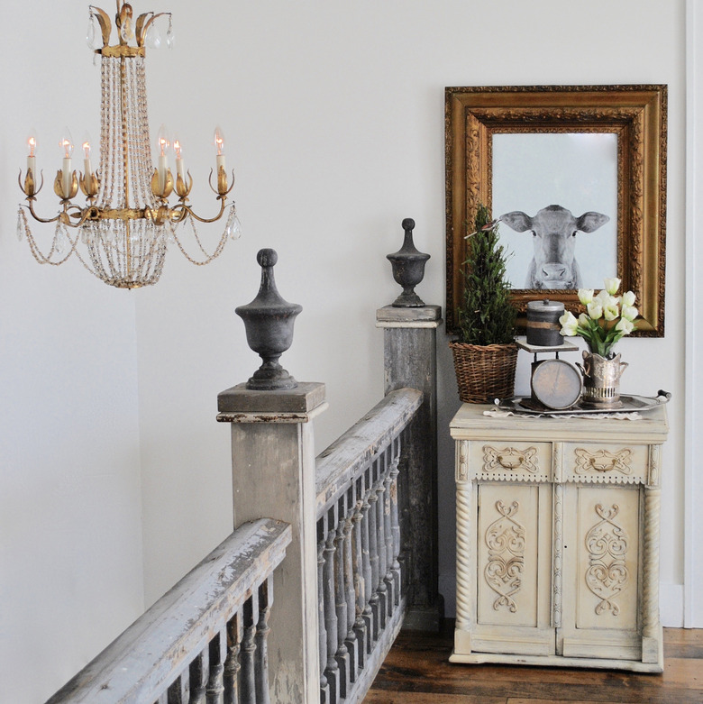 Antique farmhouse stair railing in gray chipped paint and farmhouse decor