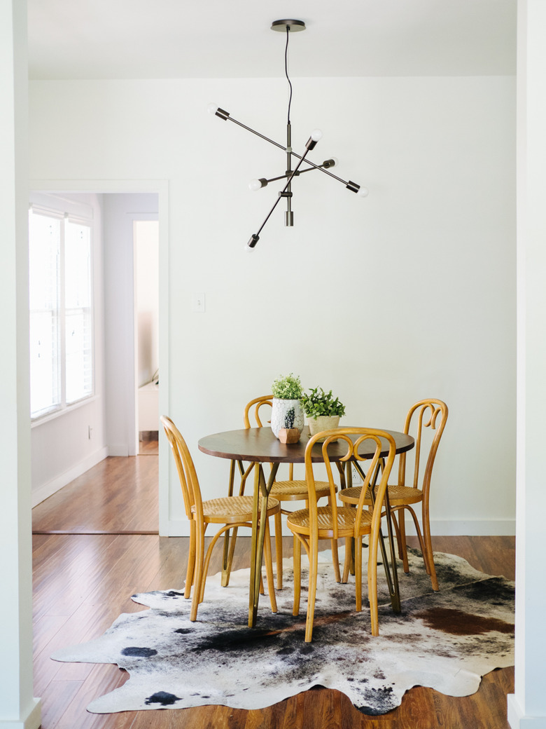 farmhouse table centerpiece idea with potted Houseplants on Dining Room Table by Caroline Joy