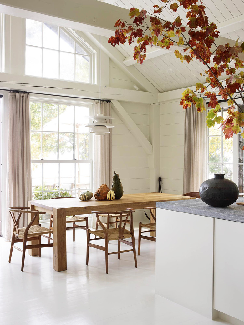 dining room with gourds on wooden table