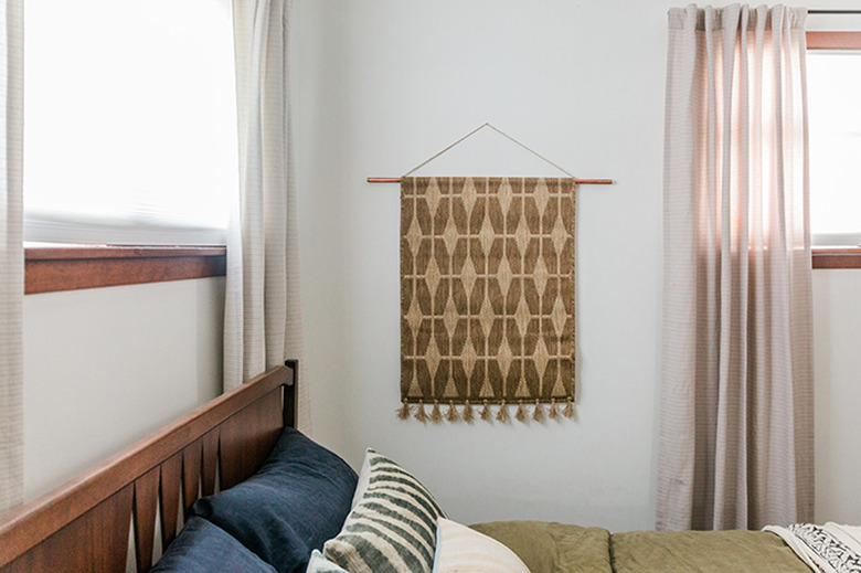 textile wall hanging in bedroom